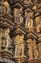 Stone carving bas relief sculptures on Vaman Temple, Khajuraho, Madhya Pradesh, India, Asia