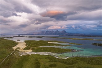 View of mountain range Seven Sisters from Herøy island, light mood, Helgeland coast, Nordland,