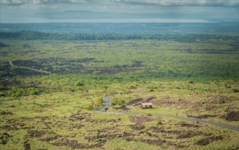 Panoramic view of a road surrounded by vegetation, Landscape of an urban road surrounded by