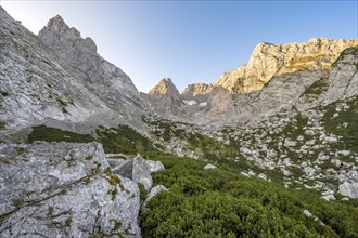 Rocky mountain peaks Schärtenspitze, Blaueisspitze and Hochkalter at sunrise, mountain tour on the