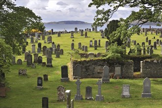 Headstones on the old Gairloch cemetery on the shores of Loch Gairloch in the Scottish Highlands,