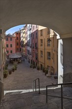 Colourful houses in Piazza Truogoli di Santa Brigada, below one of the few remaining public wash