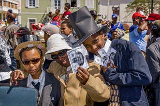 Young men, dressed as businesspeople. Carnival. Mindelo. Cabo Verde. Africa