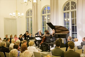 Benefit concert for Japan at the Dresden Piano Salon Yoko Yamamura, Vladimir Liutsoukov, Rie