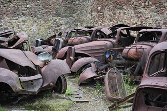 Burnt-out cars in the garage. The burnt village of Oradour-sur-Glane was destroyed on 10 June 1944