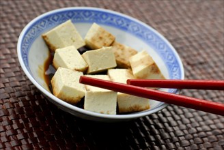 Tofu cubes with soy sauce in a bowl, chopsticks, soy bean curd, bean curd, soy, soy sauce, soy