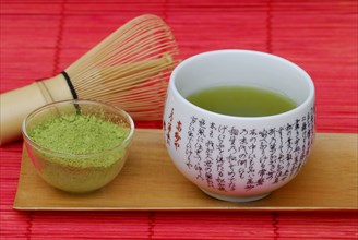 Japanese Matcha tea, 'Chasen' bamboo broom, bowl with green tea powder, green tea, green tea