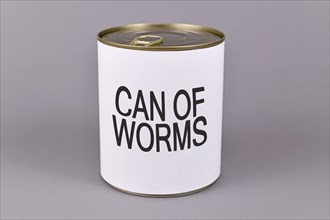 Concept for difficult situations and unpleasant experiences showing a tin can with white label and