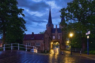 Oostport (Eastern Gate) of Delft illuminated at night. Delft, Netherlands