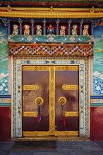 Door gate in Buddhist monastery. Mud village, Pin Valley, Himachal Pradesh, India, Asia