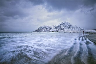 Waves on coast of Norwegian sea in fjord. Skagsanden beach, Flakstad, Lofoten islands, Norway. Long