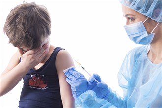 A little boy receives a vaccination, symbol motif