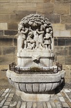 Güllbrünnlein, fountain, stone relief with children under plum tree, illustrated poem Pflaumenregen