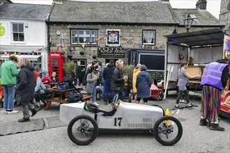 Traditional soapbox in front of crowd in town centre, Lafrowda Festival 2023, St Just in Penwith,