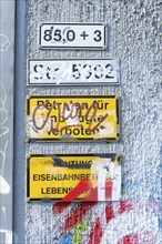 Signs defaced by sprayer on a wall, trespassing prohibited, Ulm, Baden-Württemberg, Germany, Europe