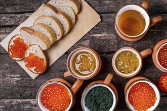 Different kinds of caviar with bread and beverages, AI generated