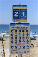 Sign with corona rules on the beach Playa Levante, Benidorm, Alicante province, Costa Blanca,