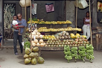 Family at the market stall, Madagascar, Africa