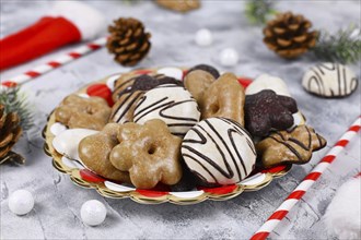 German gingerbread cookies with sugar and brown and white chocolate glazing in heart and star shape