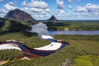 Black river and white sand beach before the granite hills, Cerros de Mavecure, Eastern Colombia