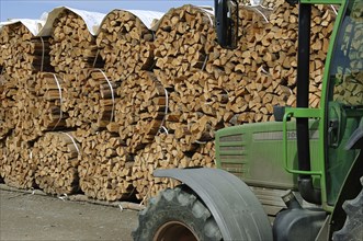 Firewood, split logs, bundled for sale