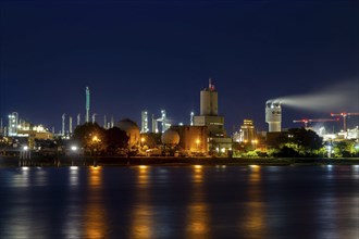 Night shot of BASF in Ludwigshafen with the Rhine in the foreground