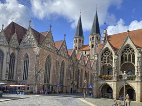 Historic Gothic-style church in the city centre under a blue sky with clouds, Altstadtmarkt,