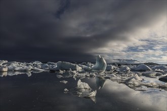 Ice floes, icebergs, glacier lagoon, lake, clouds, Jökulsarlon, Iceland, Europe