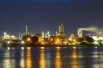 Night shot of BASF in Ludwigshafen with the Rhine in the foreground