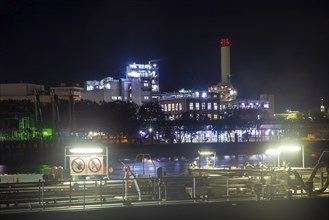 Night shot of BASF in Ludwigshafen with the Rhine in the foreground