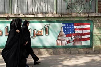 Anti american mural in tehran iran with veiled women