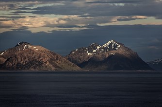 Panoramic view of the mountains on the Norwegian Sea coast at sunrise