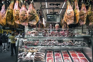 Traditional cured meat and sausage shop in la boqueria market of barcelona spain