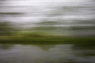 Long exposure early in the morning from a moving train, Werdohl, North Rhine-Westphalia, Germany,