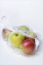 Apple in plastic bag, packaging