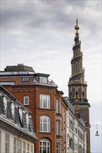 Historic houses, corkscrew-shaped tower of the Evangelical Lutheran Church of the Saviour, in front