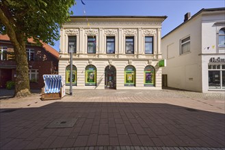 Health food store in a house decorated with stucco in the pedestrian zone of Varel, district of