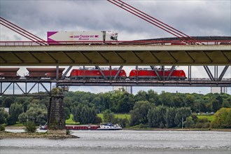 The Beeckerwerth Rhine bridge of the A42 motorway, truck traffic, in front of it the Haus-Knipp