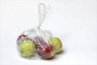 Apple in plastic bag, packaging