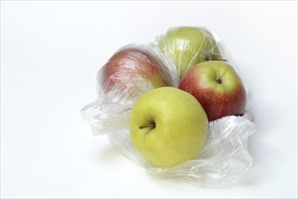 Apple in plastic bag, packaging