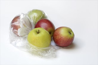 Apple in plastic bag, packaging