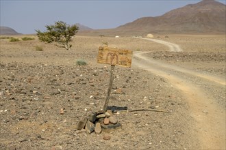 Homemade sign Mc Doland's Drive in the middle of the desert, near Sanitatis, Khumib dry river,