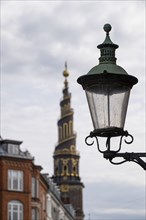 Old street lamp, corkscrew-shaped tower of the Evangelical Lutheran Church of the Saviour, in front