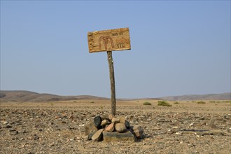 Homemade sign Mc Doland's Drive in the middle of the desert, near Sanitatis, Khumib dry river,