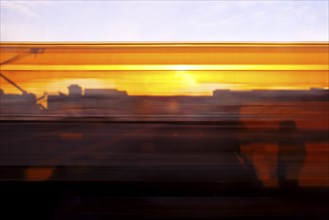 Long exposure from a moving train at sunrise, Hagen, North Rhine-Westphalia, Germany, Europe