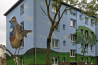 Residential buildings with a bluethroat as a mural after renovation, Bochum-Hamme, Ruhr area, North