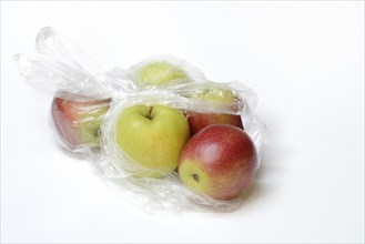 Apple in plastic bag, packaging