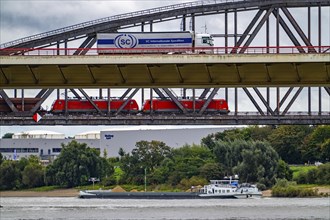 The Beeckerwerth Rhine bridge of the A42 motorway, truck traffic, in front of it the Haus-Knipp