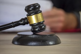 Symbolic image of a court hearing: close-up of a judge's gavel