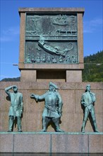 Sjomannsmonumentet south side monument to seafarers shows three historical figures, with a detailed